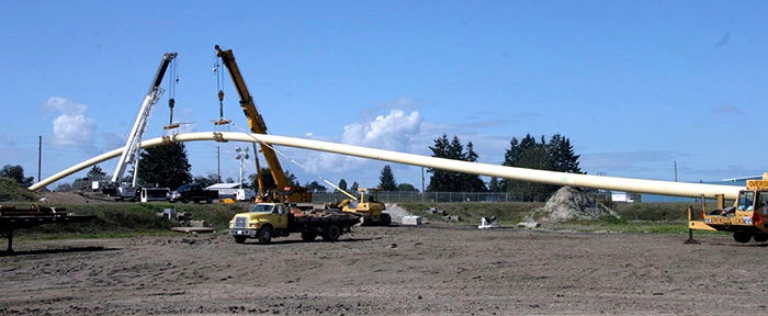 Crews Strung Preassembled Pipe Lengths Through the Air to Feed into the Drill Pit Hole